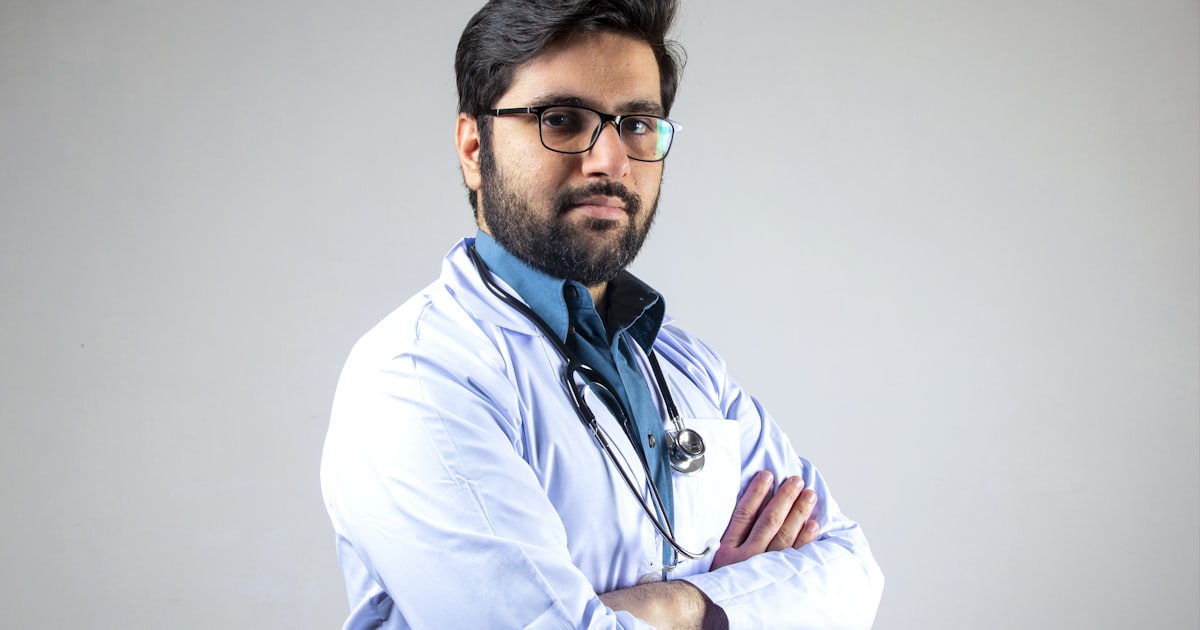 Person holding jaw in pain needing emergency dental care